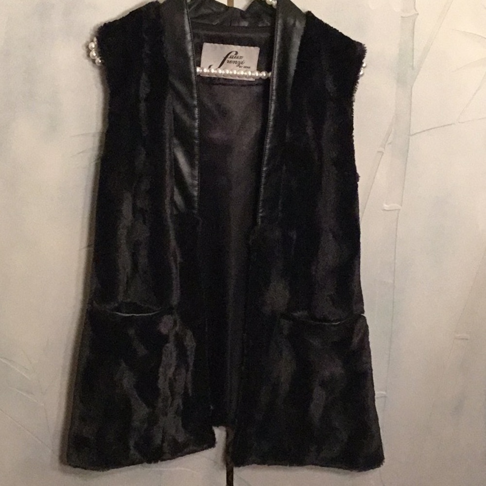 Beautiful faux fur vest with leather detail